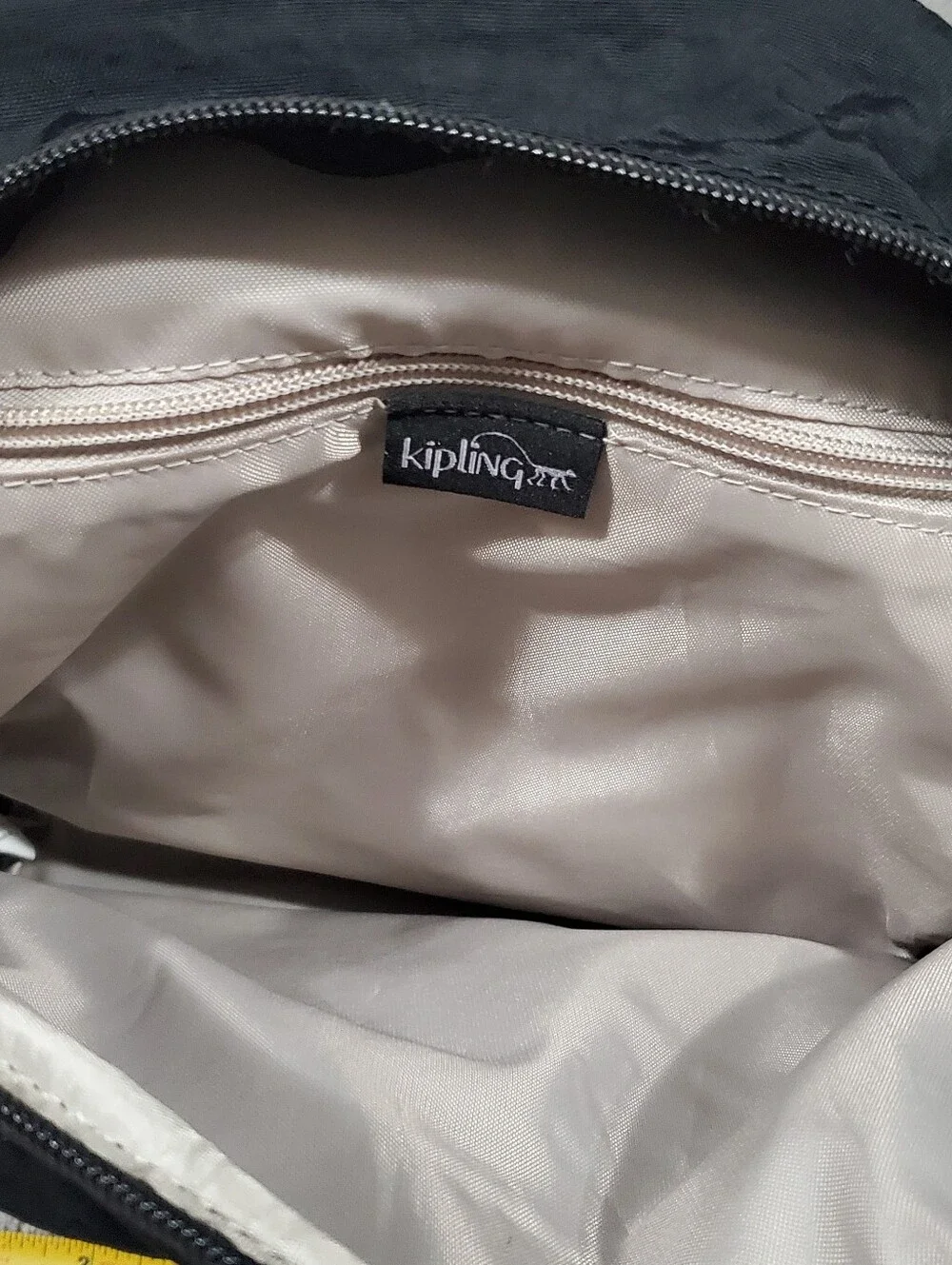 Kipling Queenie Small Backpack Black Nylon Brand Logo on the front flap.